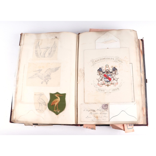 1380 - A gentleman's late Victorian scrap book containing postcards, heraldic ephemera, drawings, prints an... 