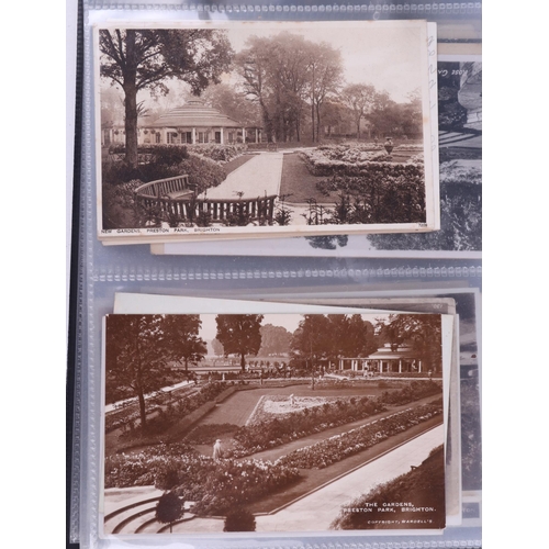 1381 - A large collection of antique and vintage Preston Park and Brighton interest postcards contained in ... 