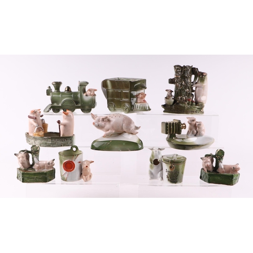 1393 - A large group of late 19th century pig fairings, various models including locomotive, bus, photograp... 