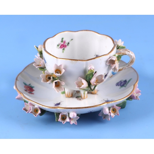 1394 - A 19th century Meissen flower encrusted cabinet cup and saucer.