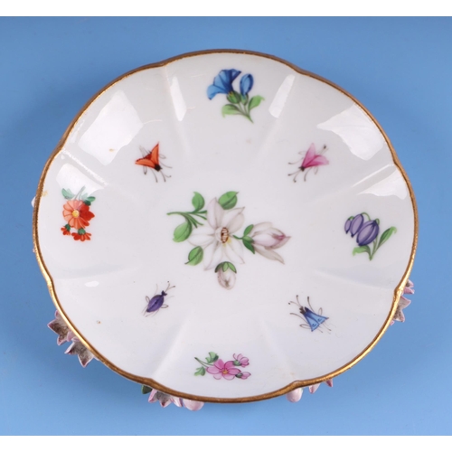 1394 - A 19th century Meissen flower encrusted cabinet cup and saucer.