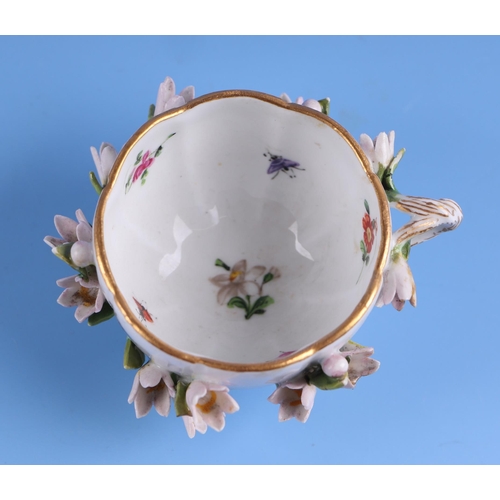 1394 - A 19th century Meissen flower encrusted cabinet cup and saucer.