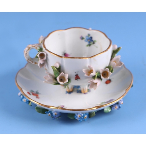 1395 - A 19th century Meissen flower encrusted cabinet cup and saucer.