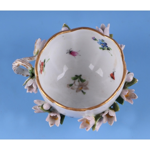 1395 - A 19th century Meissen flower encrusted cabinet cup and saucer.