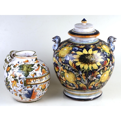 1404 - An Italian Deruta Maiolica jar and cover, decorated sunflowers with lemons and having horse head han... 