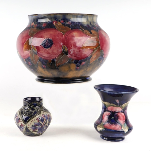 1405 - A William Moorcroft Pomegranate pattern vase, 25cms diameter; together with two other Moorcroft vase... 