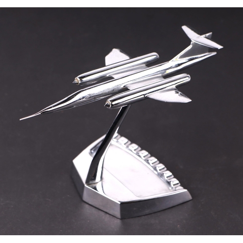 1414 - A 1960's chromed model of a fighter jet on an ashtray stand, 23cms long.