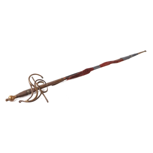 1428 - A swept hilt German rapier sword in the 17th century style. Having a brass wire bound hilt and a str... 