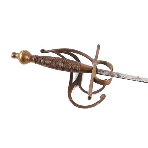 1428 - A swept hilt German rapier sword in the 17th century style. Having a brass wire bound hilt and a str... 