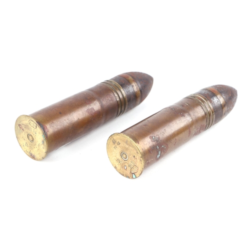 1435 - Two complete inert WWI Naval artillery shells and brass casings in two parts. Various stamp to the b... 