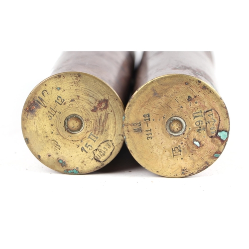 1435 - Two complete inert WWI Naval artillery shells and brass casings in two parts. Various stamp to the b... 