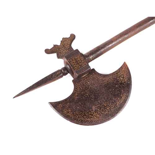 1449 - An Indo-Persian ceremonial Orr steel axe, with vestiges of gold koftgari inlay decoration, the shaft... 