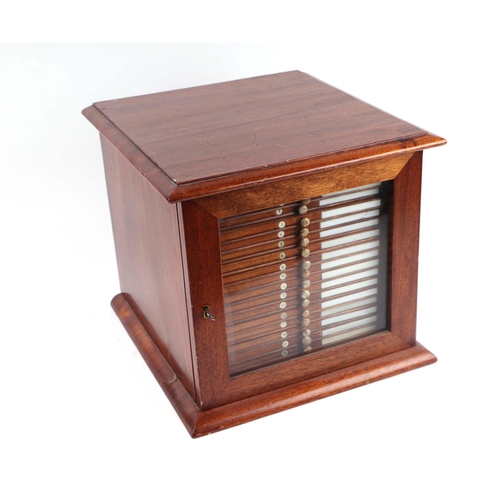 1492 - A late 19th/early 20th Century mahogany microscope slide cabinet, the single glazed door enclosing t... 