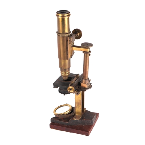 1493 - A Victorian monocular brass microscope with accessories, boxed.