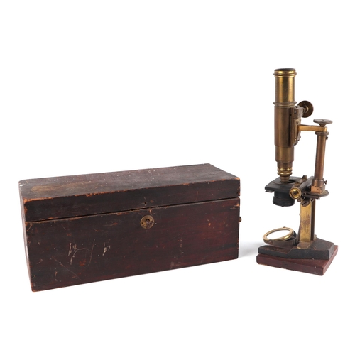 1493 - A Victorian monocular brass microscope with accessories, boxed.