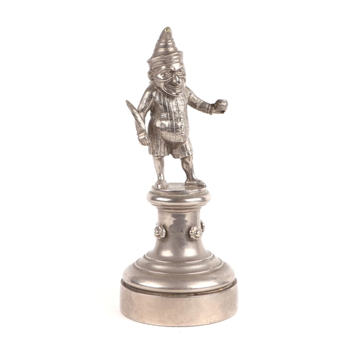 1572 - A public house figural bar lighter in the form of Mr Punch holding a feather quill, 23cm high