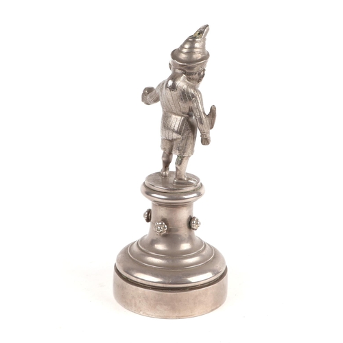 1572 - A public house figural bar lighter in the form of Mr Punch holding a feather quill, 23cm high