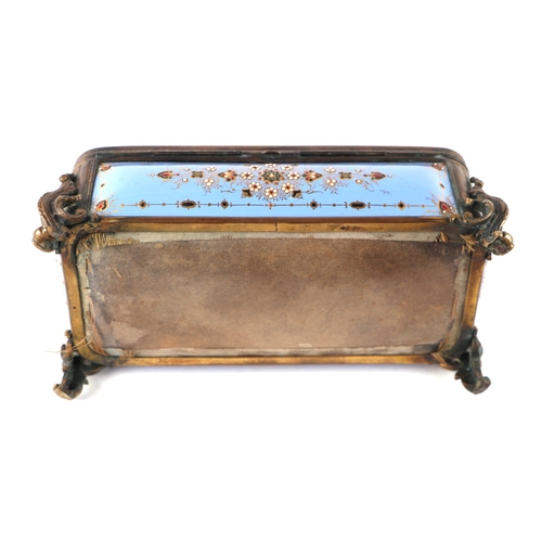 1574 - A 19th century French enamel and ormolu mounted trinket box with blue ground and jewelling, the top ... 