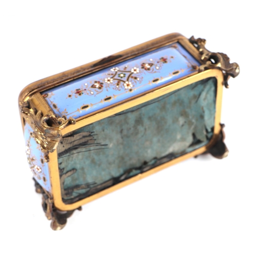 1575 - A 19th century French enamel and ormolu mounted trinket box with blue ground and jewelling, the top ... 