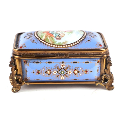 1575 - A 19th century French enamel and ormolu mounted trinket box with blue ground and jewelling, the top ... 