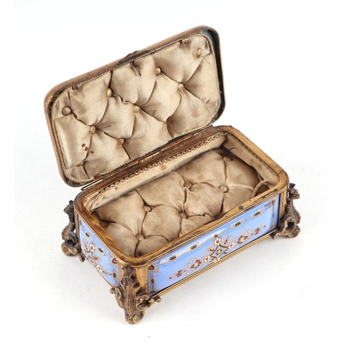 1575 - A 19th century French enamel and ormolu mounted trinket box with blue ground and jewelling, the top ... 