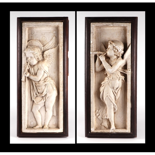 1578 - A pair of Arts & Crafts plaster relief plaques decorated with angels playing trumpets, mounted in oa... 