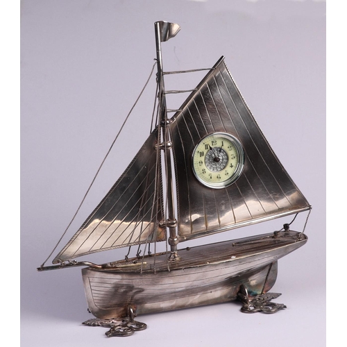 1681 - A large late 19th / early 20th century silver plated mantle clock in the form of a yacht, 33cm high