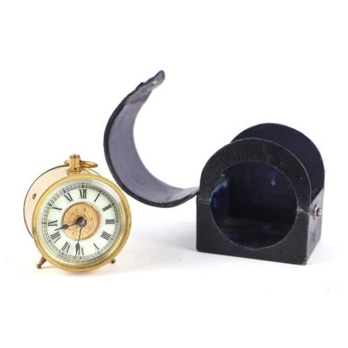 1688 - An earl 20th century American travelling alarm clock, the enamel chapter ring with Roman numerals, f... 