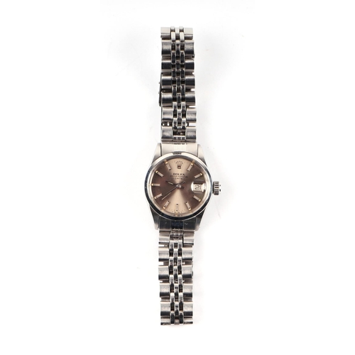 1706 - A ladies Rolex Oyster Perpetual date stainless steel wristwatch, the champagne dial with centre seco... 