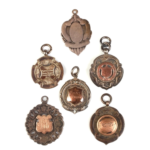 1724 - A group of silver and yellow metal mounted pocket watch fobs, various dates and makers marks, 50g.