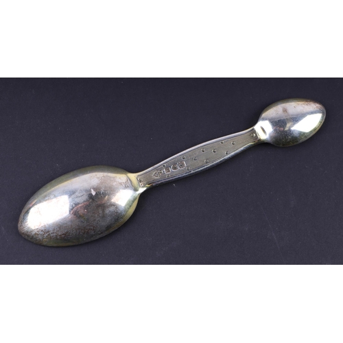 1776 - A silver gilt double ended medicine spoon, London 1911, 13cm long.