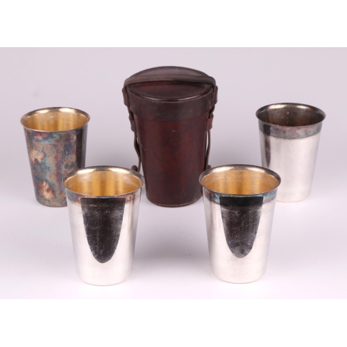 1777 - A set of four silver plated stirrup cups by Mappin & Webb in a leather case, 15cm high.