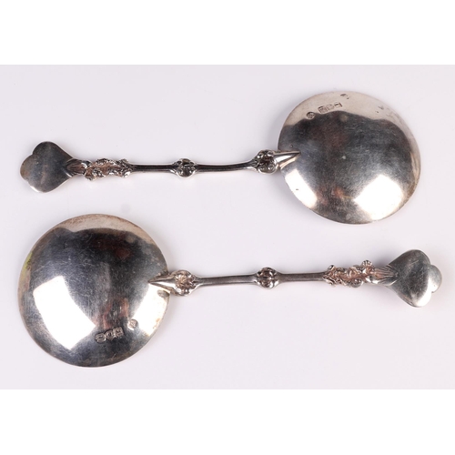 1782 - A pair of Edwardian silver spoons in the 17th century Dutch style with broad bowls and cherub finial... 