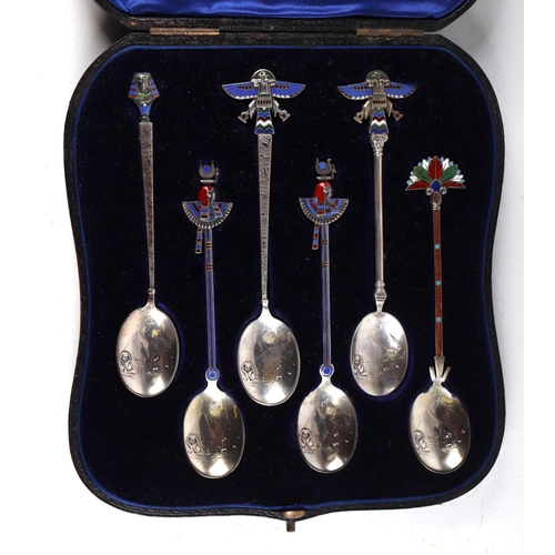 1785 - A boxed set of white metal and enamel Egyptian Revival teaspoons, the bowls decorated with a scene w... 