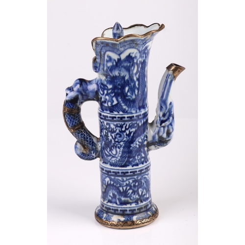 1956 - A Chinese blue and white ewer of cylindrical form decorated dragons with blue seal mark to the under... 