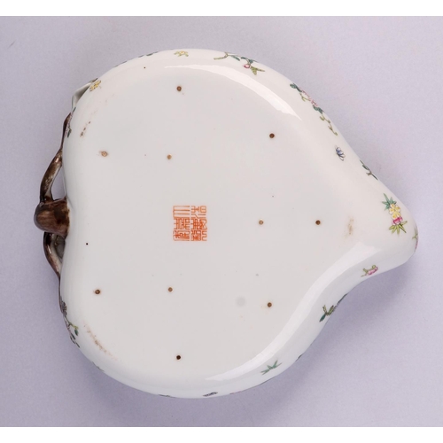 1957 - A Chinese famille rose brush washer in the form of a peach, decorated flowers with red seal mark to ... 