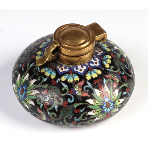 1961 - A Chinese cloisonné scholars inkwell, decorated flowers on a black ground, 9cm diameter