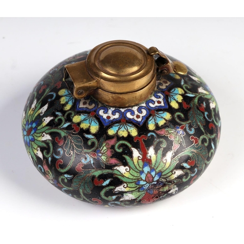 1961 - A Chinese cloisonné scholars inkwell, decorated flowers on a black ground, 9cm diameter