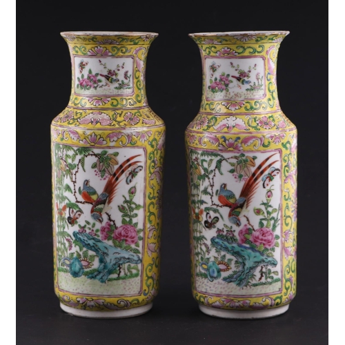 1967 - A pair of Chinese famille rose vases decorated with birds, butterflies and flowers within panels, on... 