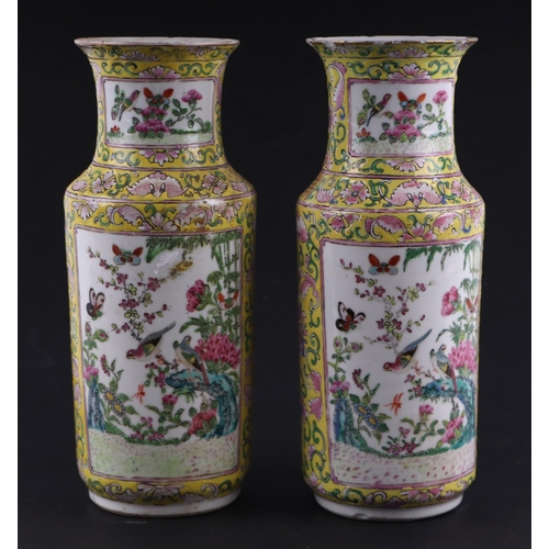 1967 - A pair of Chinese famille rose vases decorated with birds, butterflies and flowers within panels, on... 