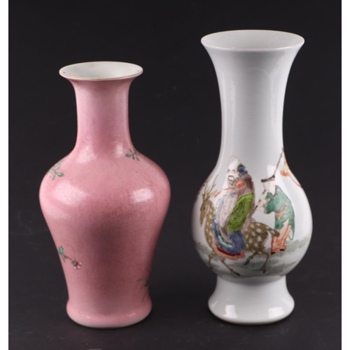 1969 - A Chinese famille rose baluster vase decorated with flowers on a pink sgraffito ground, blue seal ma... 