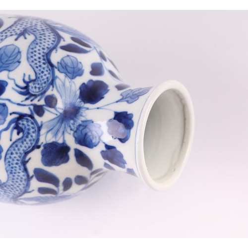 1976 - A Chinese blue and white vase decorated with dragons chasing a flaming pearl amongst foliage, 23.5cm... 