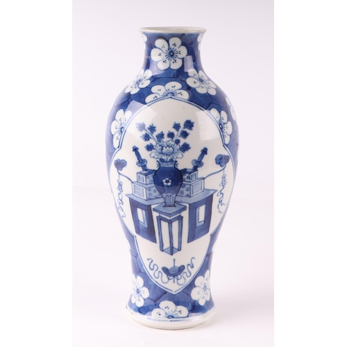 1977 - A Chinese blue & white vase decorated with precious objects on a cracked ice prunus ground, six char... 