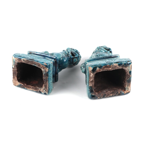 1979 - A pair of Chinese turquoise glazed temple lions on plinths, 18cms high (2).