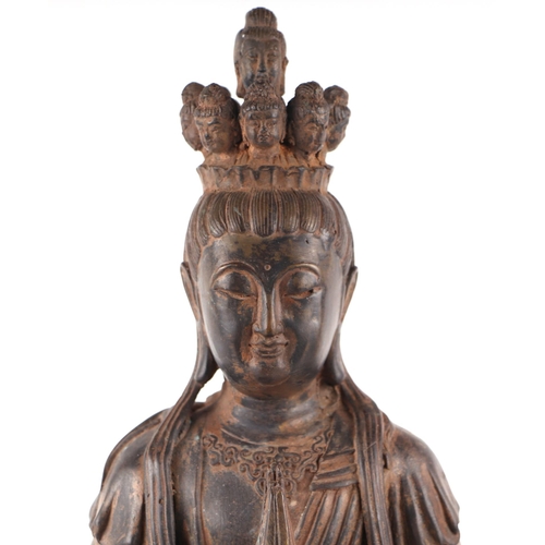 1980 - A large patinated metal multi-armed deity seated on a lotus flower, 38cms high.