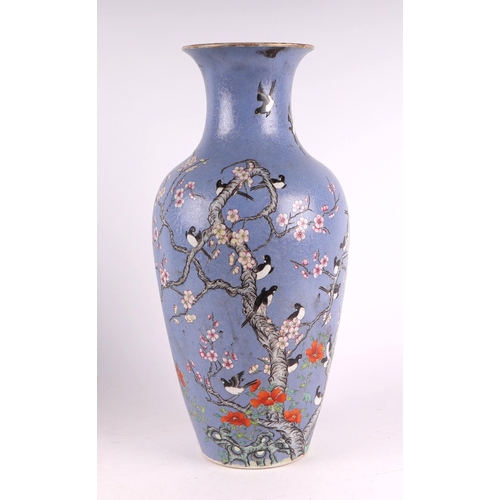 1986 - A large Chinese vase decorated with magpies and prunus on a blue sgraffito ground, red seal mark to ... 