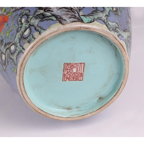 1986 - A large Chinese vase decorated with magpies and prunus on a blue sgraffito ground, red seal mark to ... 