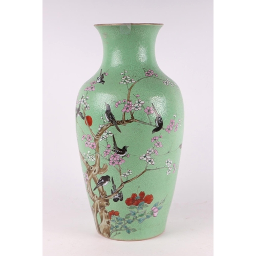 1986 - A large Chinese vase decorated with magpies and prunus on a blue sgraffito ground, red seal mark to ... 