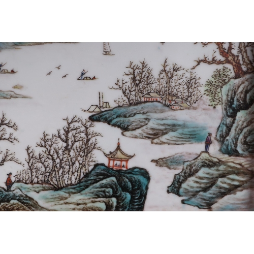 1989 - A Chinese rectangular porcelain plaque depicting a river landscape scene, framed, 42 by 26cms.