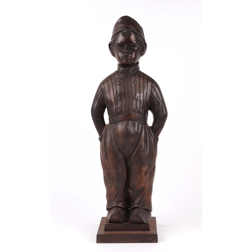 1991 - A cast iron Dutch Boy fireside companion, stamped 'Nestor, Made in England' 52cm high.